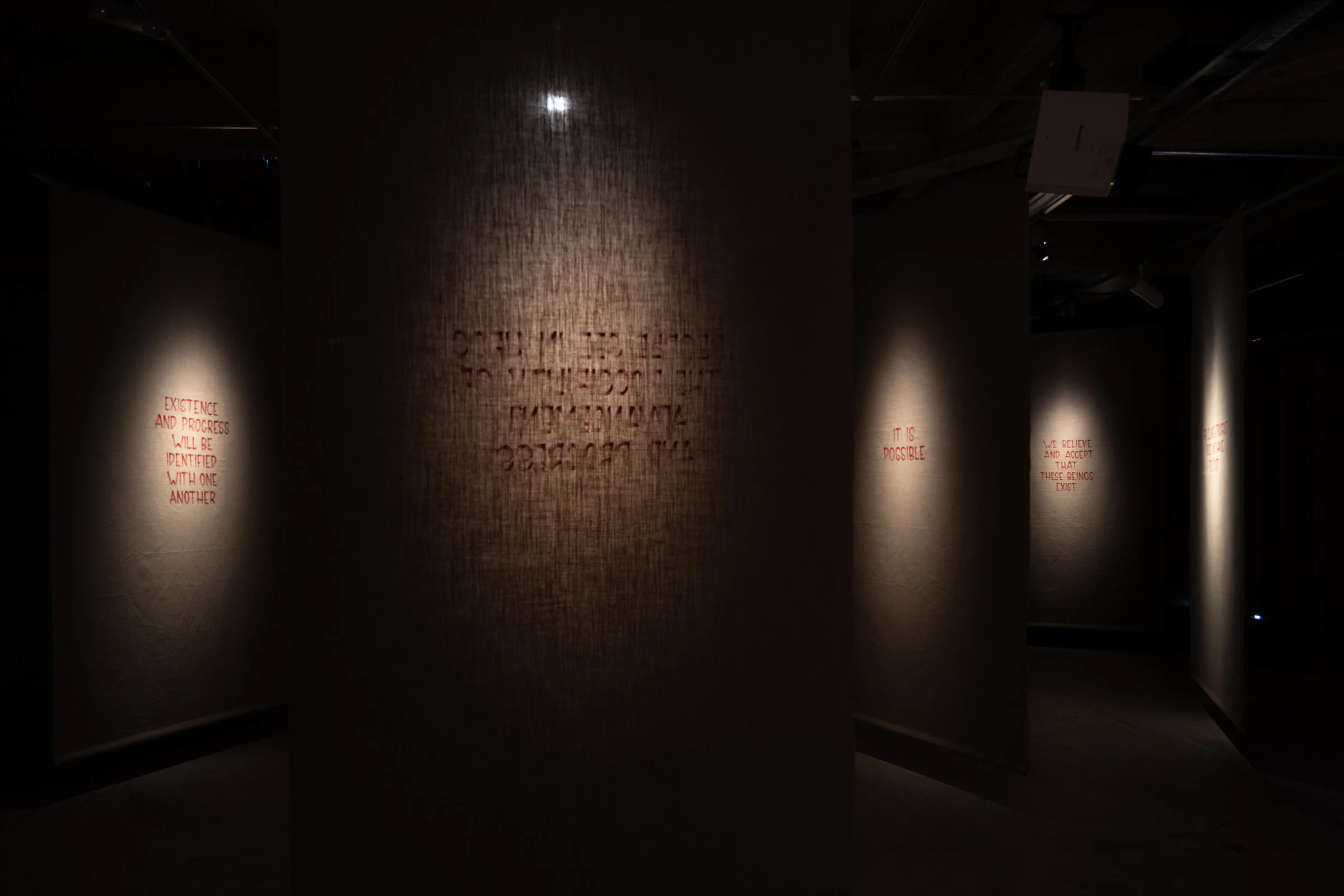 Hand-lettered banners in the earlier presentation of Axel Straschnoy’s exhibition at EMMA in Espoo.